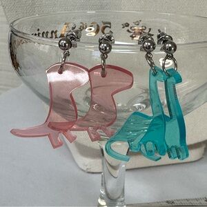 Two pair of dinosaur earrings